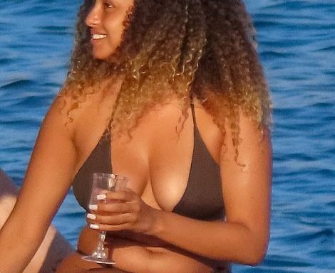 Fun in the sun! Love Island's Amber Gill looked in high spirits as she donned a tiny bikini and sipped on cocktails during a boozy Mykonos boat trip