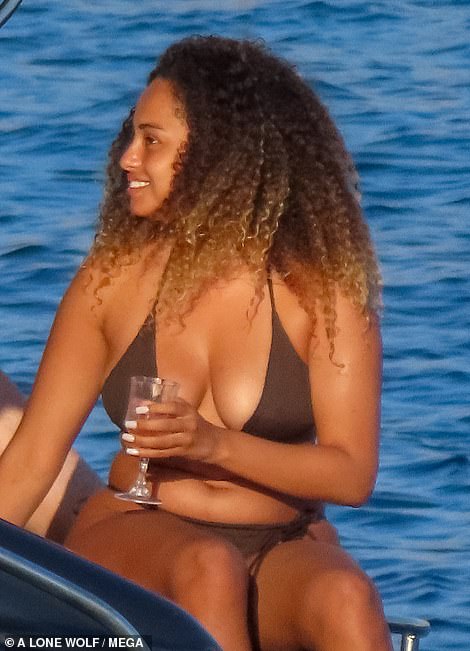 Fun in the sun! Love Island's Amber Gill looked in high spirits as she donned a tiny bikini and sipped on cocktails during a boozy Mykonos boat trip