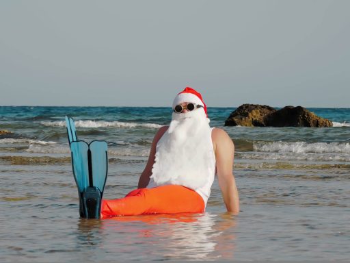 Funny Santa Claus at the beach